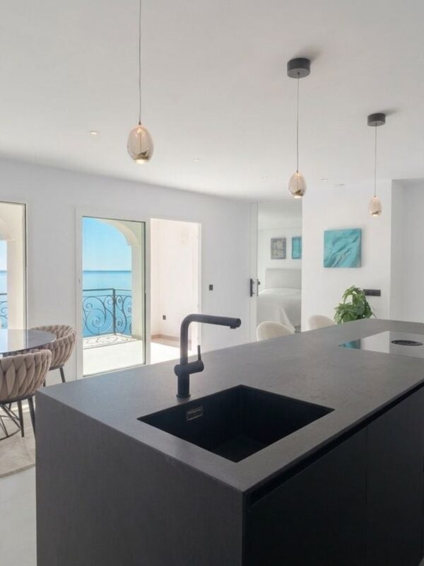 Sea view duplex penthouse for sale in port d'andratx with private rooftop and direct sea access